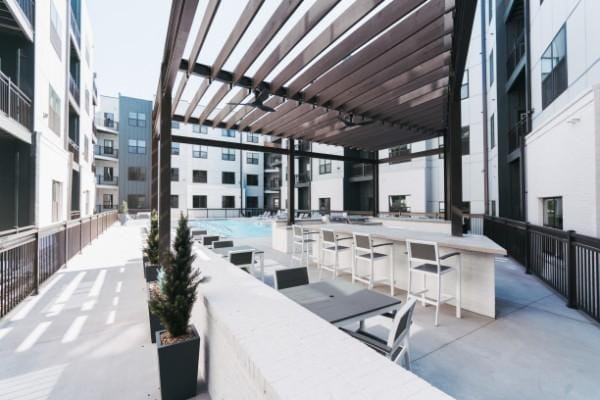 1677 54th Ave N Unit 318, Nashville, TN 37209 - view of patio / terrace featuring a bar