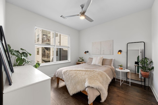 1677 54th Ave N Unit 318, Nashville, TN 37209 - bedroom with dark wood-type flooring, ceiling fan, and baseboards