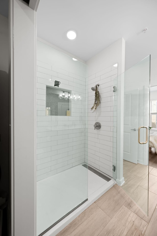1677 54th Ave N Unit 318, Nashville, TN 37209 - full bathroom with a stall shower and wood finished floors