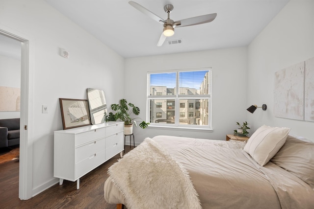 1677 54th Ave N Unit 318, Nashville, TN 37209 - bedroom with dark wood-style floors, baseboards, and ceiling fan