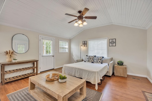bedroom featuring baseboards, lofted ceiling, light wood finished floors, and wooden ceiling