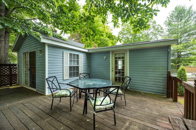 wooden deck featuring outdoor dining space