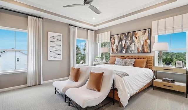 bedroom with baseboards, ornamental molding, carpet floors, and multiple windows