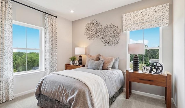 carpeted bedroom with recessed lighting and baseboards