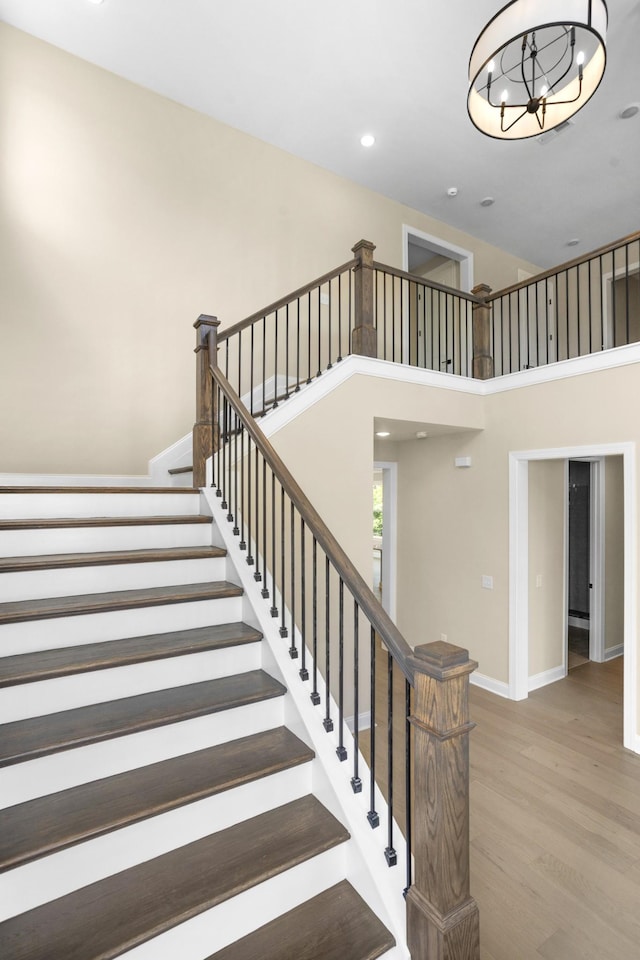 5958 Hunt Valley Dr, Spring Hill, TN 37174 - stairway with wood finished floors, recessed lighting, a chandelier, and a high ceiling