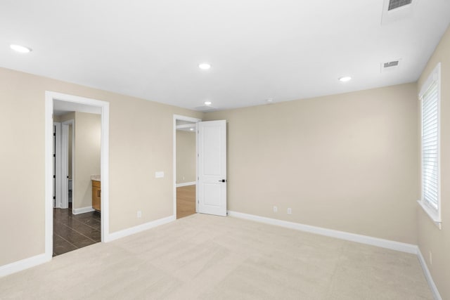 5958 Hunt Valley Dr, Spring Hill, TN 37174 - unfurnished bedroom featuring light carpet and recessed lighting