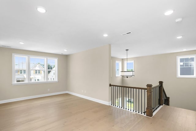 5958 Hunt Valley Dr, Spring Hill, TN 37174 - empty room featuring wood finished floors, healthy amount of natural light, recessed lighting, and a smoke detector