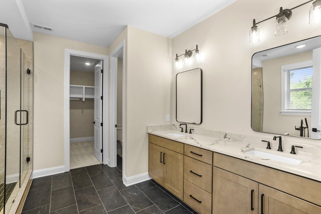 5958 Hunt Valley Dr, Spring Hill, TN 37174 - full bath with double vanity, a stall shower, and a spacious closet