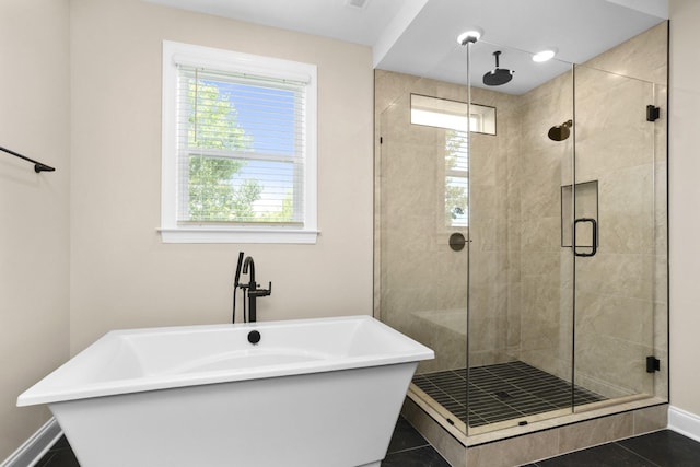 5958 Hunt Valley Dr, Spring Hill, TN 37174 - bathroom with a stall shower, a soaking tub, and tile patterned floors