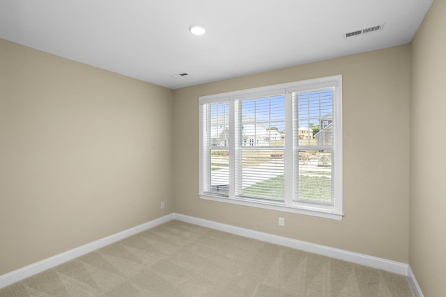5958 Hunt Valley Dr, Spring Hill, TN 37174 - spare room featuring light colored carpet, plenty of natural light, and recessed lighting