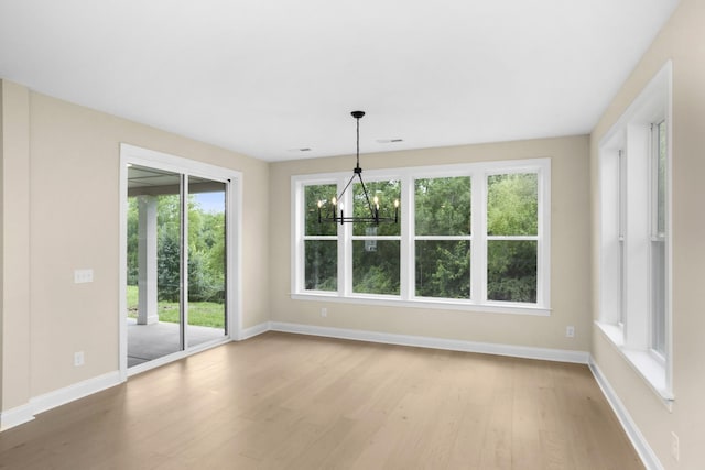 5958 Hunt Valley Dr, Spring Hill, TN 37174 - unfurnished dining area featuring wood finished floors and a chandelier