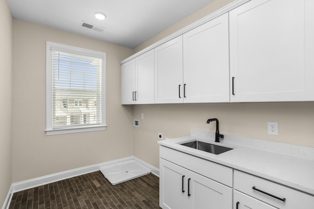 5958 Hunt Valley Dr, Spring Hill, TN 37174 - washroom featuring washer hookup, cabinet space, healthy amount of natural light, and hookup for an electric dryer