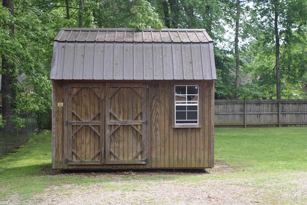 view of shed with fence