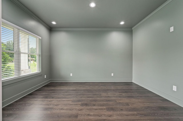 spare room with ornamental molding, dark wood finished floors, and recessed lighting