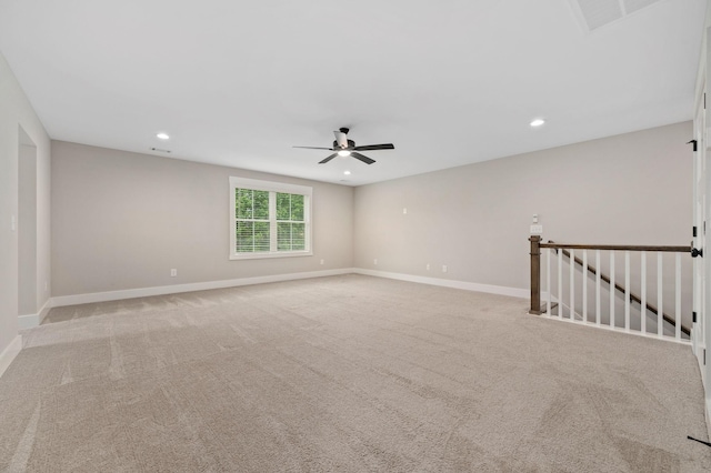 empty room featuring a ceiling fan, visible vents, baseboards, light carpet, and recessed lighting