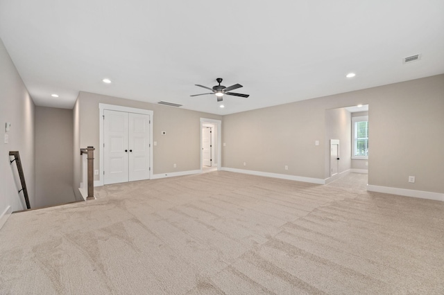 empty room featuring baseboards, recessed lighting, and visible vents