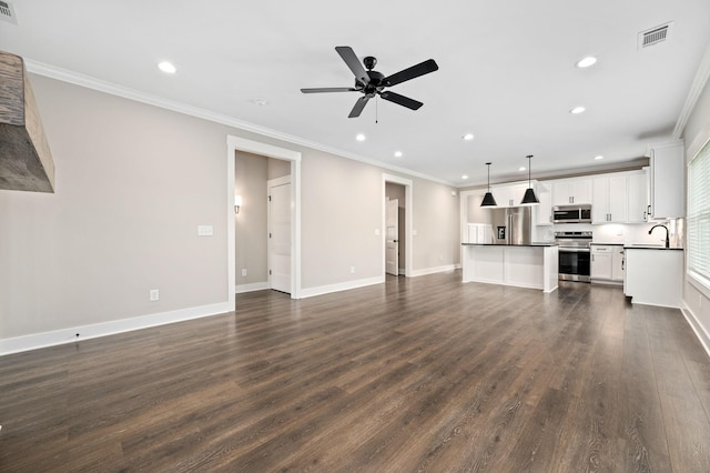 unfurnished living room with crown molding, dark wood-style floors, ceiling fan, and recessed lighting