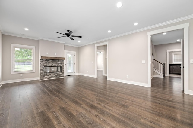 unfurnished living room featuring recessed lighting, stairway, dark wood-style floors, baseboards, and a stone fireplace