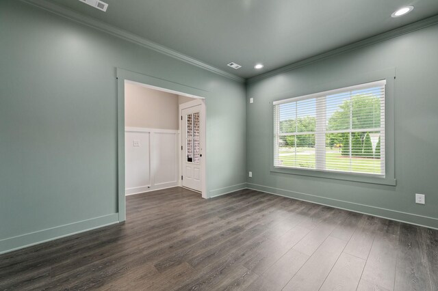 spare room featuring baseboards, dark wood-style flooring, ornamental molding, and recessed lighting