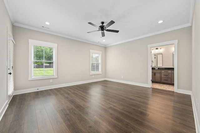 unfurnished bedroom featuring dark wood finished floors, baseboards, ornamental molding, and recessed lighting