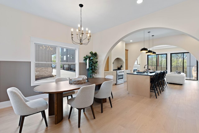 736 Douglas Ave, Nashville, TN 37207 - dining area featuring light wood-style floors, a chandelier, a healthy amount of sunlight, and recessed lighting