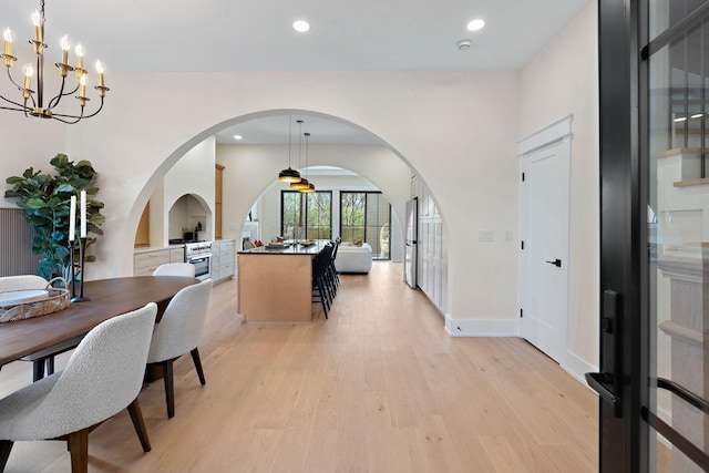 736 Douglas Ave, Nashville, TN 37207 - interior space with a notable chandelier, light wood-type flooring, baseboards, arched walkways, and recessed lighting