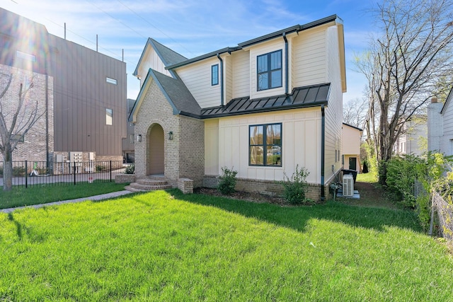 736 Douglas Ave, Nashville, TN 37207 - view of front of house with metal roof, board and batten siding, a front yard, fence private yard, and a standing seam roof