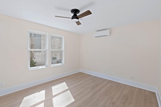 736 Douglas Ave, Nashville, TN 37207 - empty room featuring baseboards, ceiling fan, light wood-type flooring, and an AC wall unit