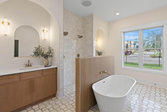 736 Douglas Ave, Nashville, TN 37207 - bathroom featuring walk in shower, vanity, tile patterned floors, and a freestanding tub