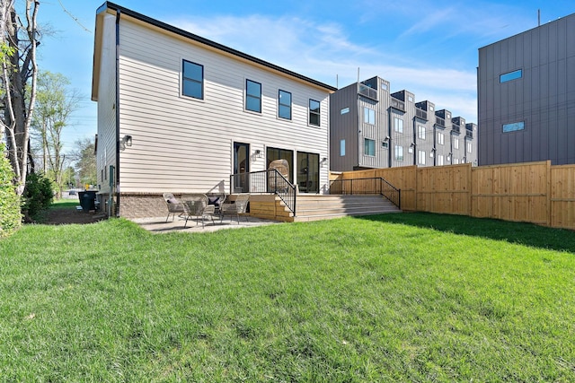 736 Douglas Ave, Nashville, TN 37207 - back of house featuring a yard, fence private yard, and a patio