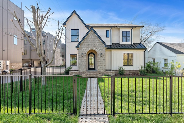 736 Douglas Ave, Nashville, TN 37207 - view of front facade featuring a fenced front yard, a standing seam roof, brick siding, and board and batten siding