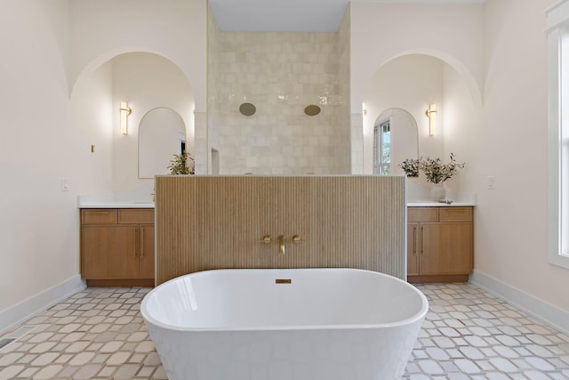 736 Douglas Ave, Nashville, TN 37207 - full bath featuring a soaking tub, tile patterned floors, two vanities, and a walk in shower