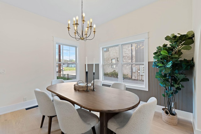 736 Douglas Ave, Nashville, TN 37207 - dining area with an inviting chandelier, light wood-type flooring, visible vents, and baseboards