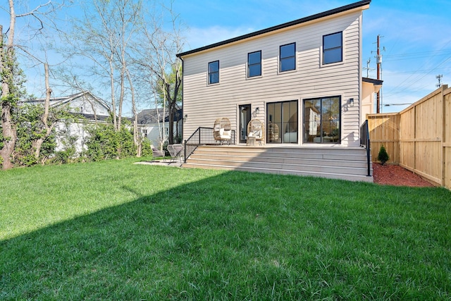 736 Douglas Ave, Nashville, TN 37207 - rear view of property featuring a lawn, a wooden deck, and a fenced backyard