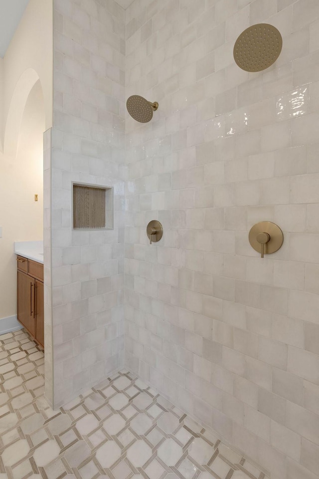 736 Douglas Ave, Nashville, TN 37207 - bathroom featuring vanity, tiled shower, and tile patterned floors