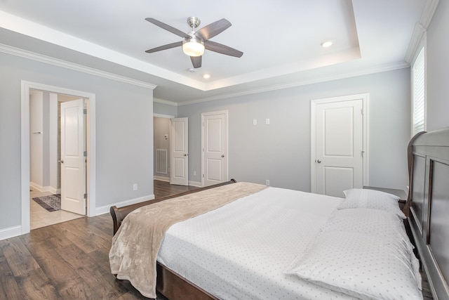 5509 Dana Ln, Franklin, TN 37064 - bedroom featuring dark wood finished floors, a tray ceiling, recessed lighting, ornamental molding, and baseboards
