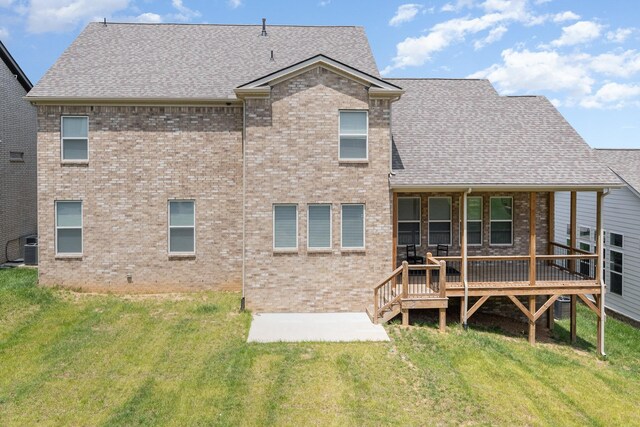 5509 Dana Ln, Franklin, TN 37064 - back of property featuring a shingled roof, a lawn, central AC, and a patio