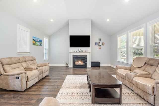 5509 Dana Ln, Franklin, TN 37064 - living area with dark wood-style floors, vaulted ceiling, a fireplace with flush hearth, baseboards, and recessed lighting