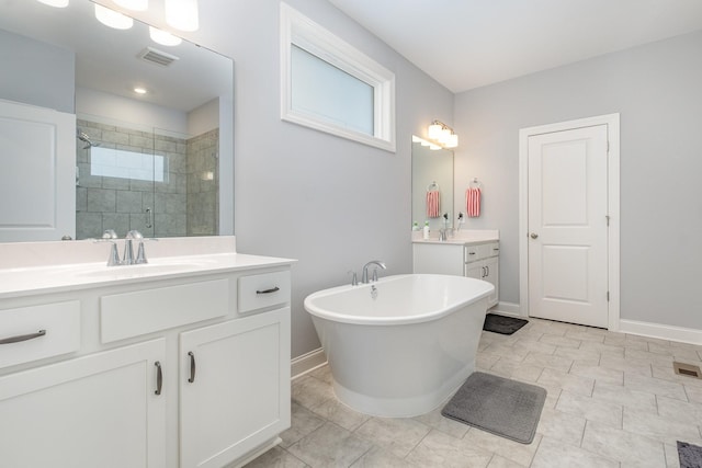 5509 Dana Ln, Franklin, TN 37064 - full bathroom featuring a shower stall, baseboards, two vanities, and a freestanding bath