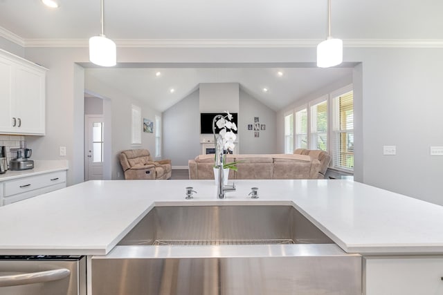 5509 Dana Ln, Franklin, TN 37064 - kitchen featuring open floor plan, a sink, light countertops, pendant lighting, and vaulted ceiling