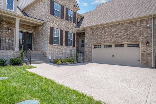 5509 Dana Ln, Franklin, TN 37064 - view of front of property featuring brick siding, concrete driveway, and a garage