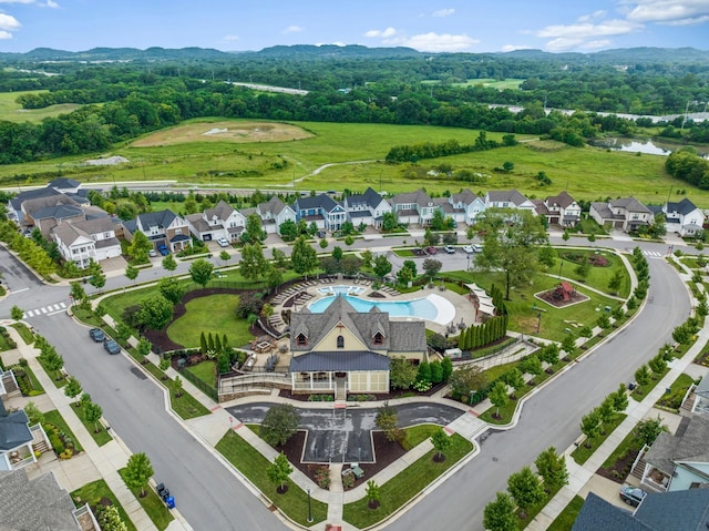 bird's eye view with a residential view and a water and mountain view
