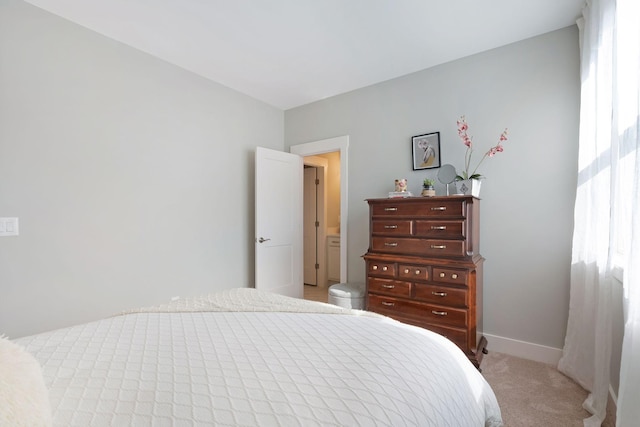 bedroom with carpet flooring and baseboards