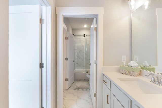 bathroom with toilet, marble finish floor, vanity, and combined bath / shower with glass door