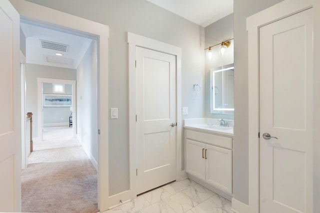 bathroom with baseboards, marble finish floor, vanity, and visible vents