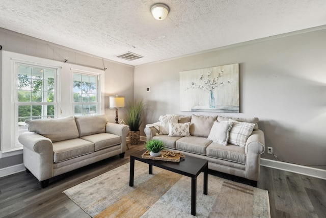 living room featuring a textured ceiling, baseboards, visible vents, and dark wood finished floors
