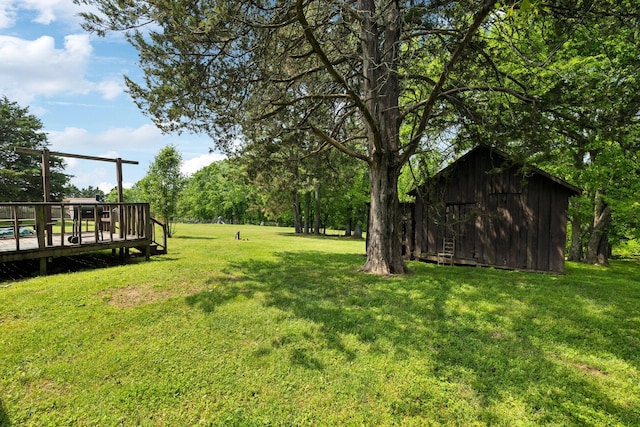 view of yard featuring a wooden deck