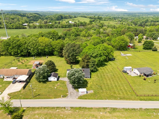 aerial view featuring a rural view and a view of trees