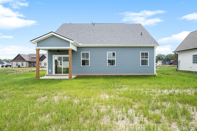 10114 Bighorn Ln, Bell Buckle, TN 37020 - back of house featuring a yard, a shingled roof, a patio, and a ceiling fan