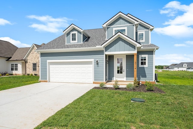10114 Bighorn Ln, Bell Buckle, TN 37020 - view of front of home featuring concrete driveway, a front yard, a garage, and board and batten siding